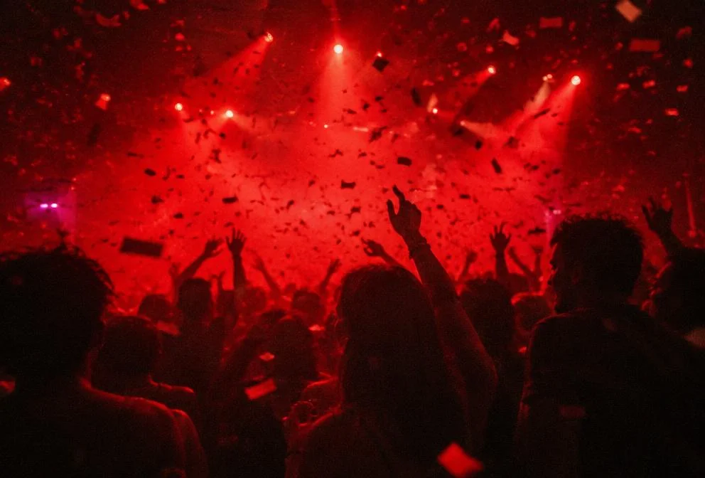 Confetti falling over a dancing crowd